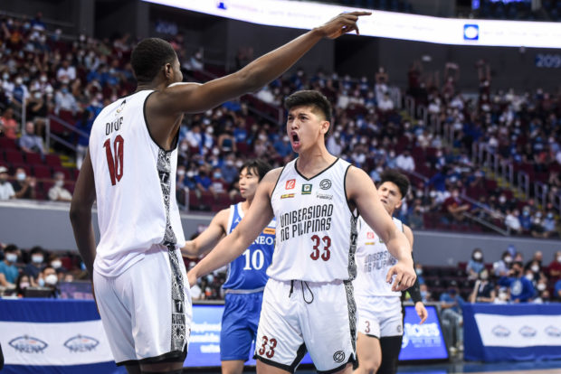 UP Fighting Maroons forward Carl Tamayo celebrates during a win over the Ateneo Blue Eagles in the UAAP Season 85 men's basketball tournament at Mall of Asia Arena. UAAP PHOTO