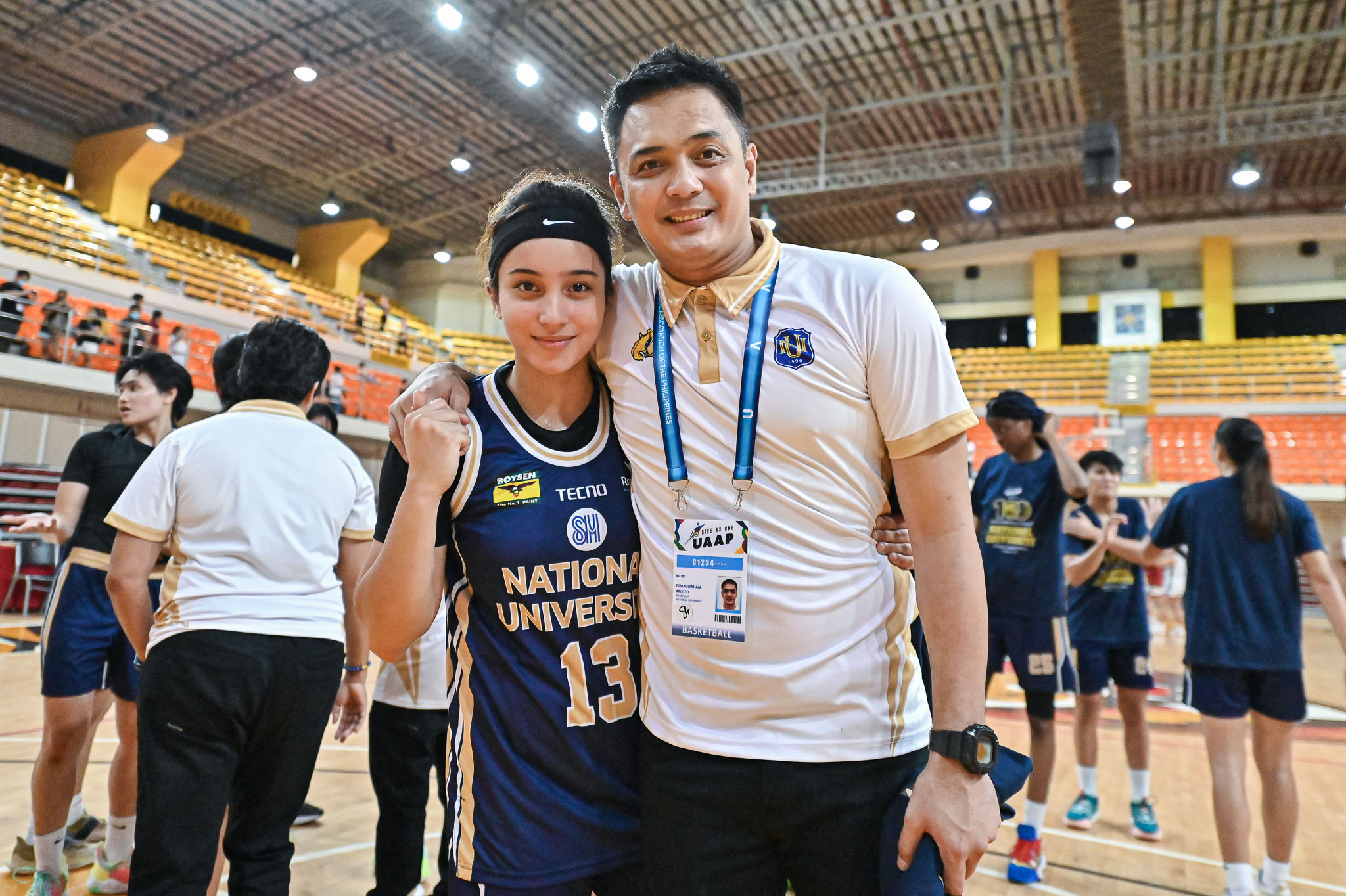 NU coach Aris Dimaunahan with his daughter Christiana.