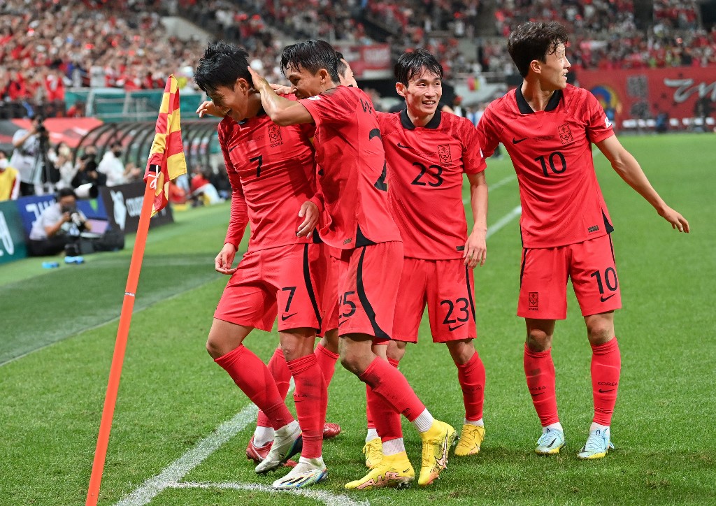 Son Heung-min (L) of South Korea celebrates a goal with his teammates against Cameroon during a football friendly match between South Korea and Cameroon in Seoul on September 27, 2022. 