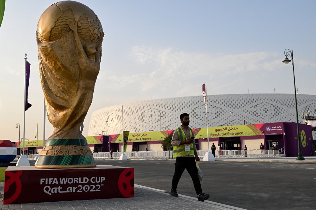 A man walks outside the Al-Thumama Stadium in Doha on November 8, 2022, ahead of the Qatar 2022 FIFA World Cup football tournament. 