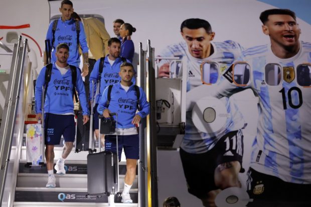 Argentina's forward Lionel Messi (2R) and his teammates arrive at Hamad International Airport in Doha on November 17, 2022, ahead of the Qatar 2022 World Cup football tournament. 