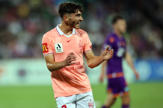 Josh Cavallo of Adelaide United gestures during the Australian A League football match with Perth Glory in Perth on November 20, 2021.