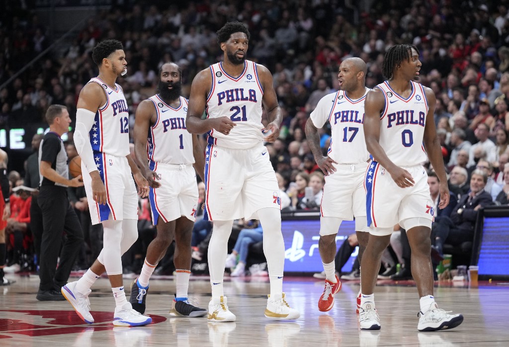 FILE– Joel Embiid #21, Tyrese Maxey #0, Tobias Harris #12, James Harden #1 and P.J. Tucker #17 of the Philadelphia 76ers react during a break in play against the Toronto Raptors during the second half of their basketball game at the Scotiabank Arena on October 26, 2022 in Toronto, Ontario, Canada.