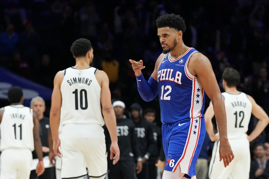  Tobias Harris #12 of the Philadelphia 76ers reacts in front of Ben Simmons #10 of the Brooklyn Nets in the fourth quarter of the game at the Wells Fargo Center on November 22, 2022 in Philadelphia, Pennsylvania. The 76ers defeated the Nets 115-106. 
