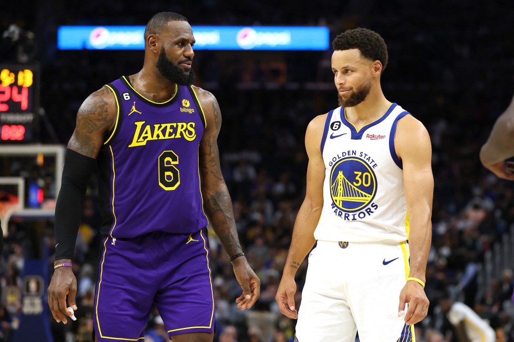LeBron James #6 of the Los Angeles Lakers speaks to Stephen Curry #30 of the Golden State Warriors during their game at Chase Center on October 18, 2022 in San Francisco, 