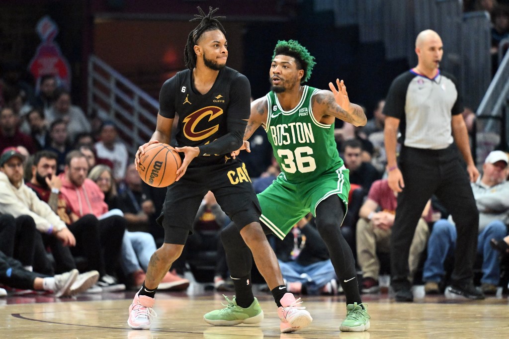 Darius Garland #10 of the Cleveland Cavaliers runs a play while under pressure from Marcus Smart #36 of the Boston Celtics d2q at Rocket Mortgage Fieldhouse on November 02, 2022 in Cleveland, Ohio. 