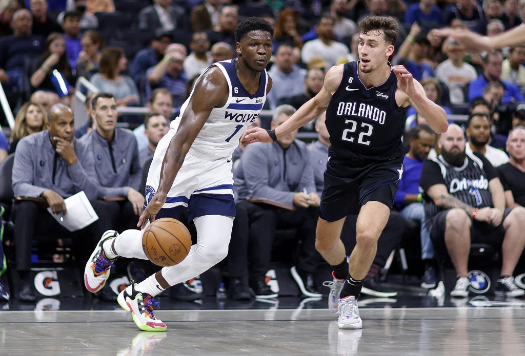  Anthony Edwards #1 of the Minnesota Timberwolves drives on Franz Wagner #22 of the Orlando Magic during a game at Amway Center on November 16, 2022 in Orlando, Florida.