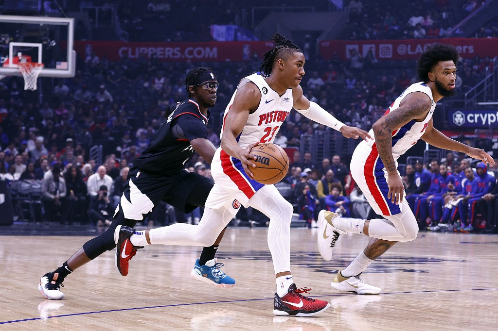 Jaden Ivey #23 of the Detroit Pistons controls the ball against Reggie Jackson #1 of the LA Clippers in the first half at Crypto.com Arena on November 17, 2022 in Los Angeles, California.