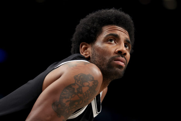 Brooklyn Nets guard Kyrie Irving (11) waits for play to start after a time out during the fourth quarter against the Detroit Pistons at Barclays Center.