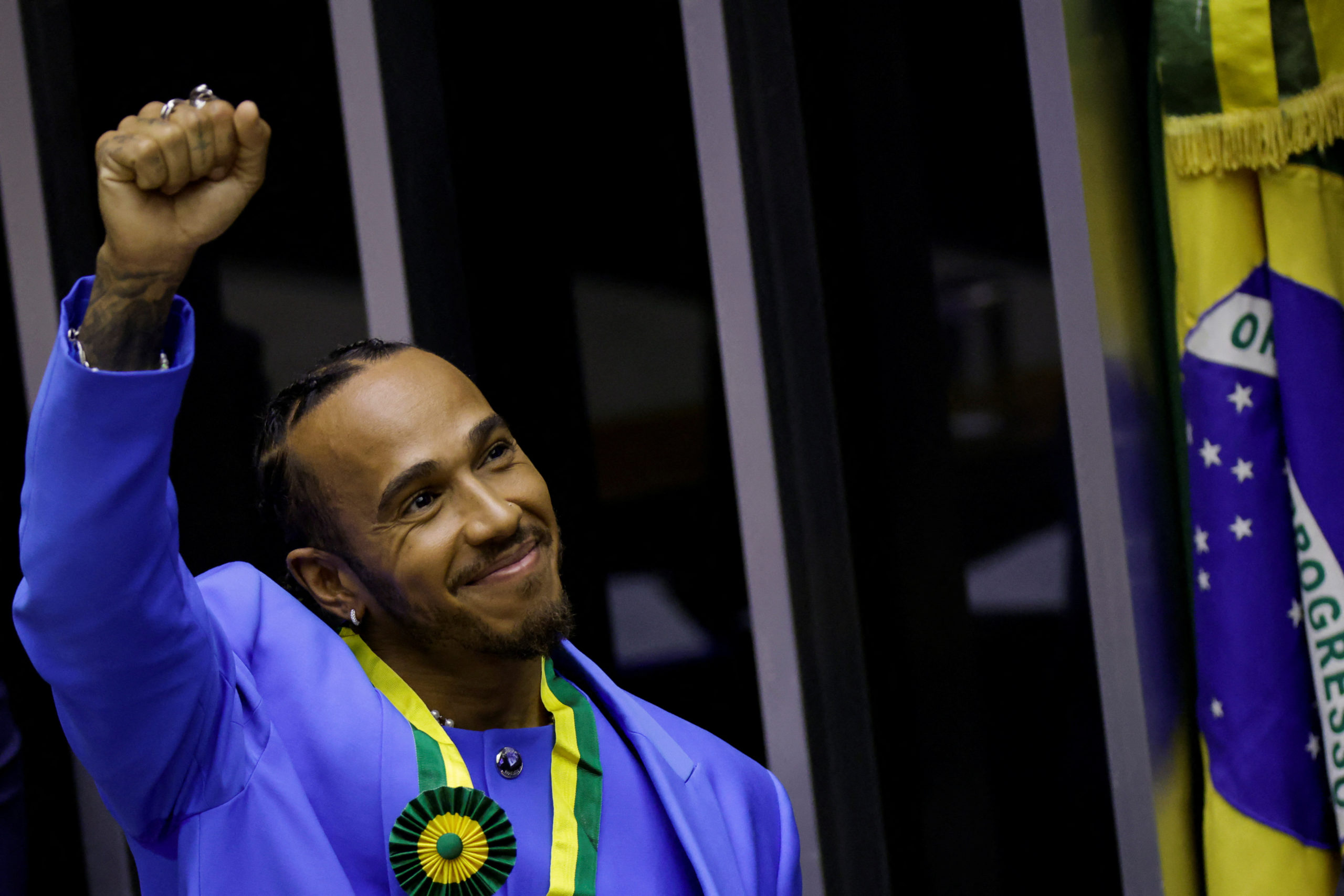 British Formula One racing driver, Lewis Hamilton gestures, after he received the title of honorary citizen of Brazil at the Chamber of Deputies in Brasilia, Brazil November 7, 2022. 