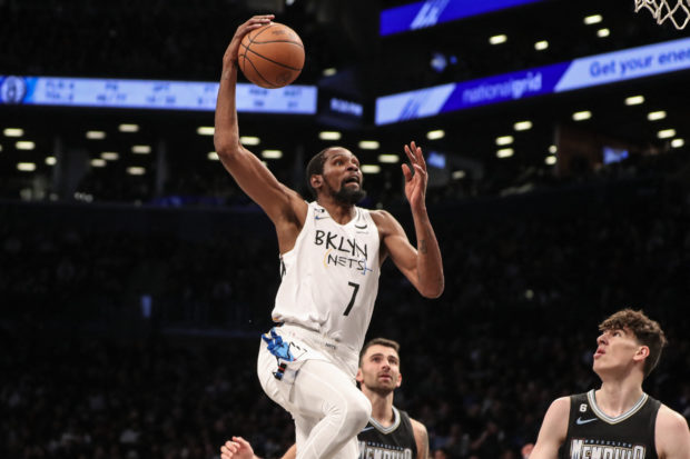 Nov 20, 2022; Brooklyn, New York, USA;  Brooklyn Nets forward Kevin Durant (7) goes up for a dunk in the fourth quarter against the Memphis Grizzlies at Barclays Center. 