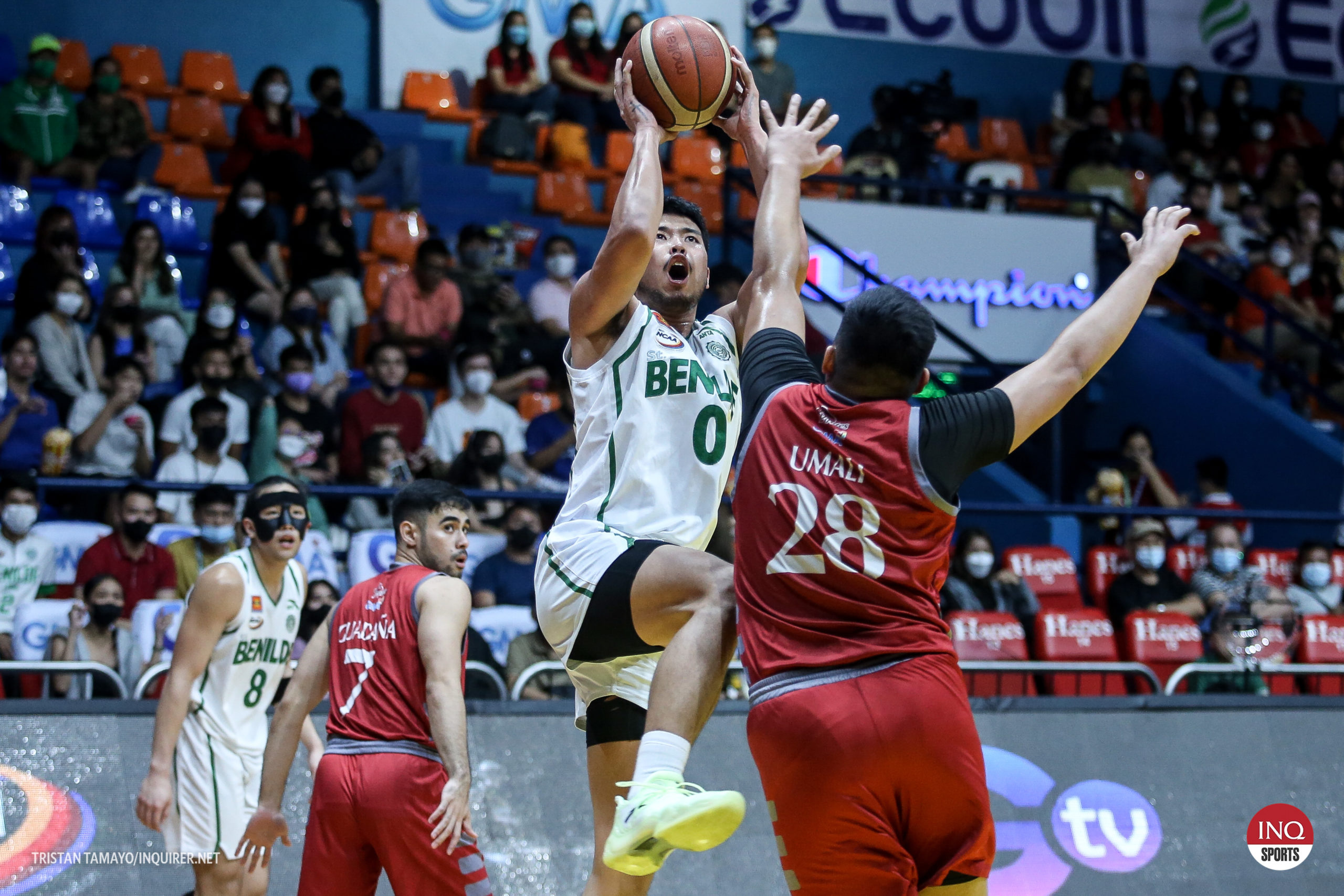 St. Benilde’s Will Gozum (right) produces a double-double in the victory. —NCAA/GMA