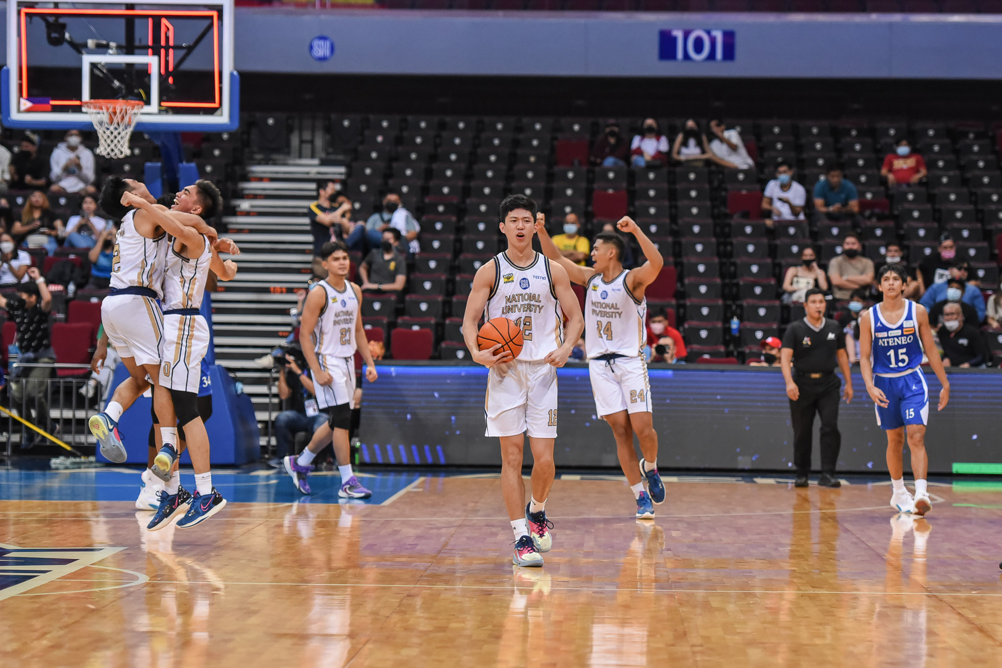 The NU Bulldogs celebrate their win over Ateneo Blue Eagles in the UAAP Season 85 Men's Basketball Tournament.  –PHOTO UAAP