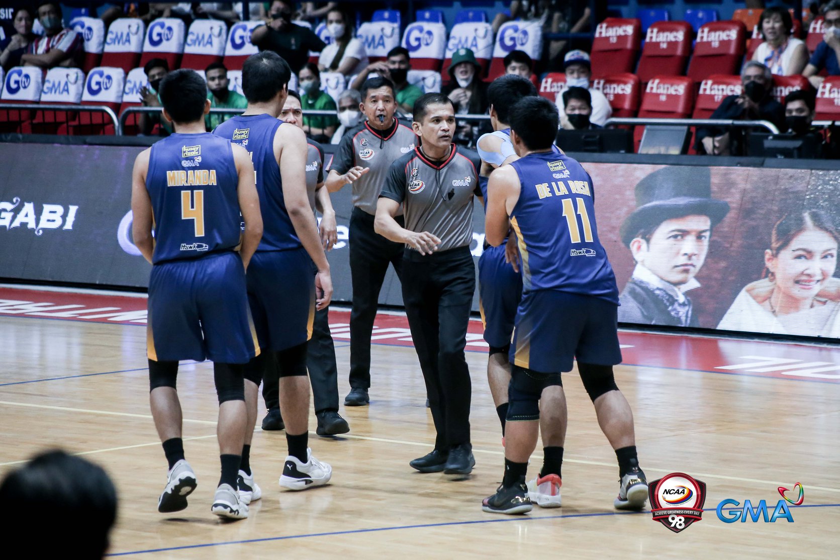 JRU's John Amores trying to confront a referee.
