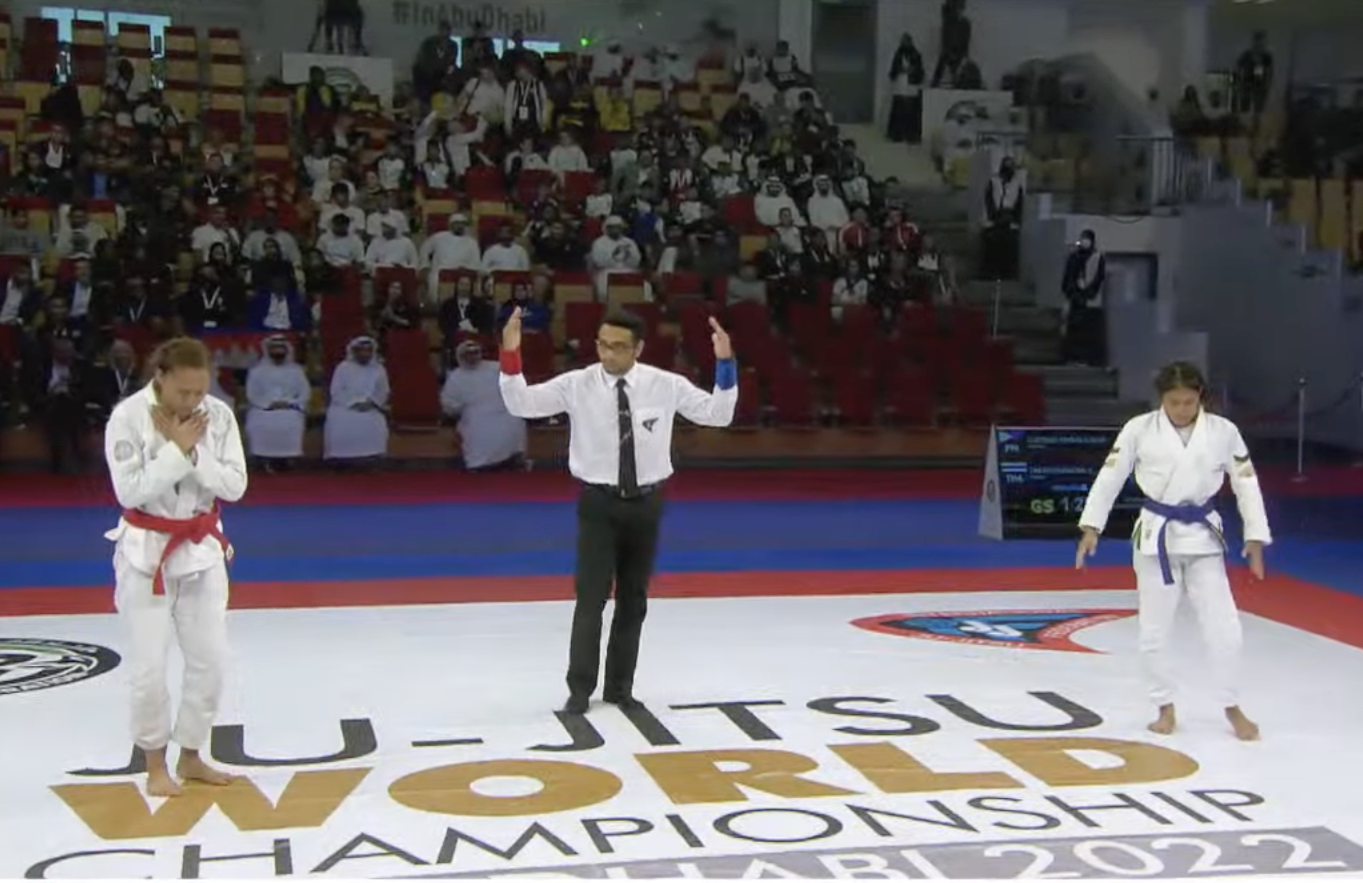 Kimberly Custodio (left) wins gold in the JJIF Jiu-Jitsu World Championship.