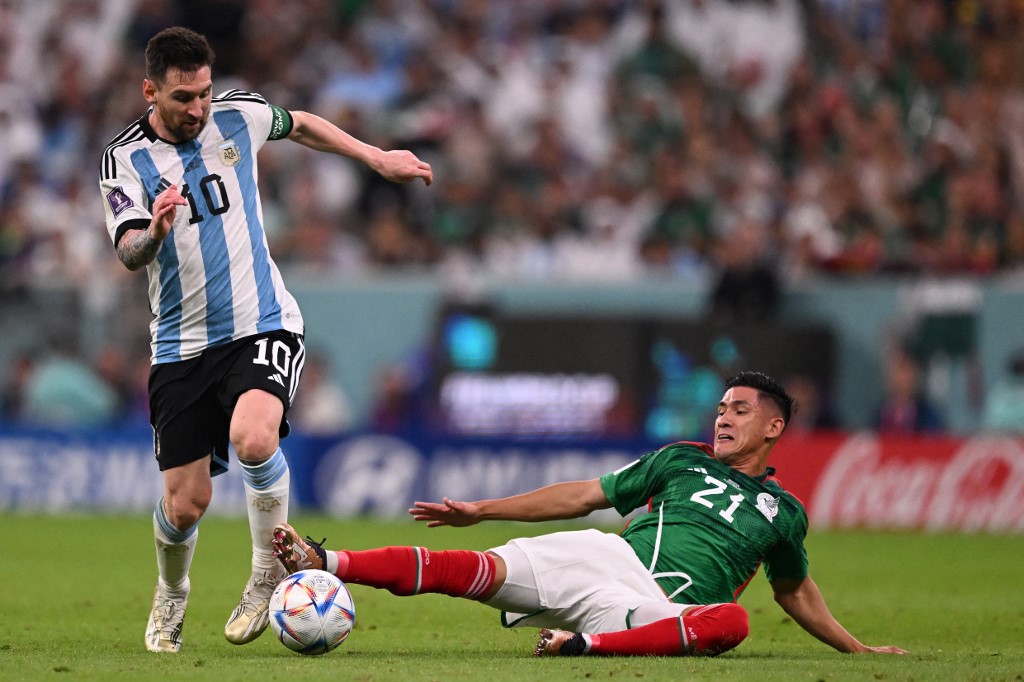 Argentina's forward #10 Lionel Messi (L) and Mexico's midfielder #21 Uriel Antuna fight for the ball during the Qatar 2022 World Cup Group C football match between Argentina and Mexico at the Lusail Stadium in Lusail, north of Doha on November 26, 2022. 