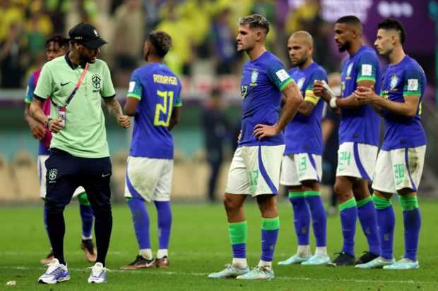 Neymar and teammates react at the end of the Qatar 2022 World Cup Group G football match between Cameroon and Brazil at the Lusail Stadium in Lusail, north of Doha on December 2, 2022.