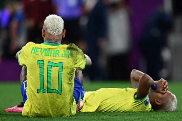 Brazil's forward #10 Neymar and Brazil's forward #21 Rodrygo react after losing in the penalty shoot-out after extra-time of the Qatar 2022 World Cup quarter-final football match between Croatia and Brazil at Education City Stadium in Al-Rayyan, west of Doha, on December 9, 2022. (Photo by GABRIEL BOUYS / AFP)