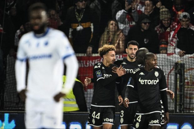 Monaco's French midfielder Eliesse Ben Seghir (C) celebrates with his teammates after scoring a goal during the French L1 football match between AJ Auxerre and AS Monaco at the Abbe Deschamps stadium in Auxerre, on December 28, 2022.