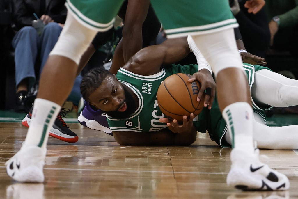 Jaylen Brown #7 of the Boston Celtics gathers a loose ball against the Los Angeles Clippers during the second half at TD Garden on December 29, 2022 in Boston, Massachusetts.