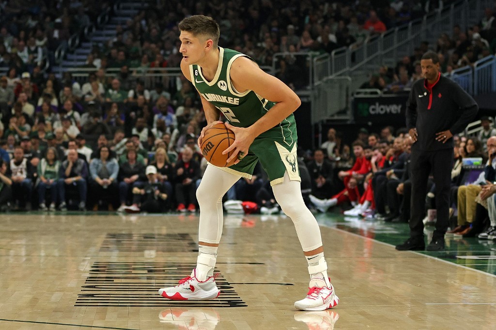 Grayson Allen #12 of the Milwaukee Bucks handles the ball during a game against the Houston Rockets at Fiserv Forum on October 22, 2022 in Milwaukee, Wisconsin. 