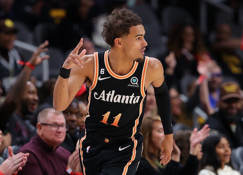 Trae Young #11 of the Atlanta Hawks reacts after hitting a three-point basket against the Miami Heat during the first half at State Farm Arena on November 27, 2022 in Atlanta, Georgia.