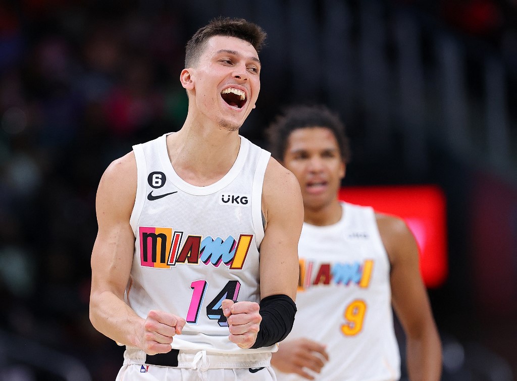 Tyler Herro #14 of the Miami Heat reacts after a three-point basket by Dru Smith #9 against the Atlanta Hawks during the second half at State Farm Arena on November 27, 2022 in Atlanta, Georgia. 