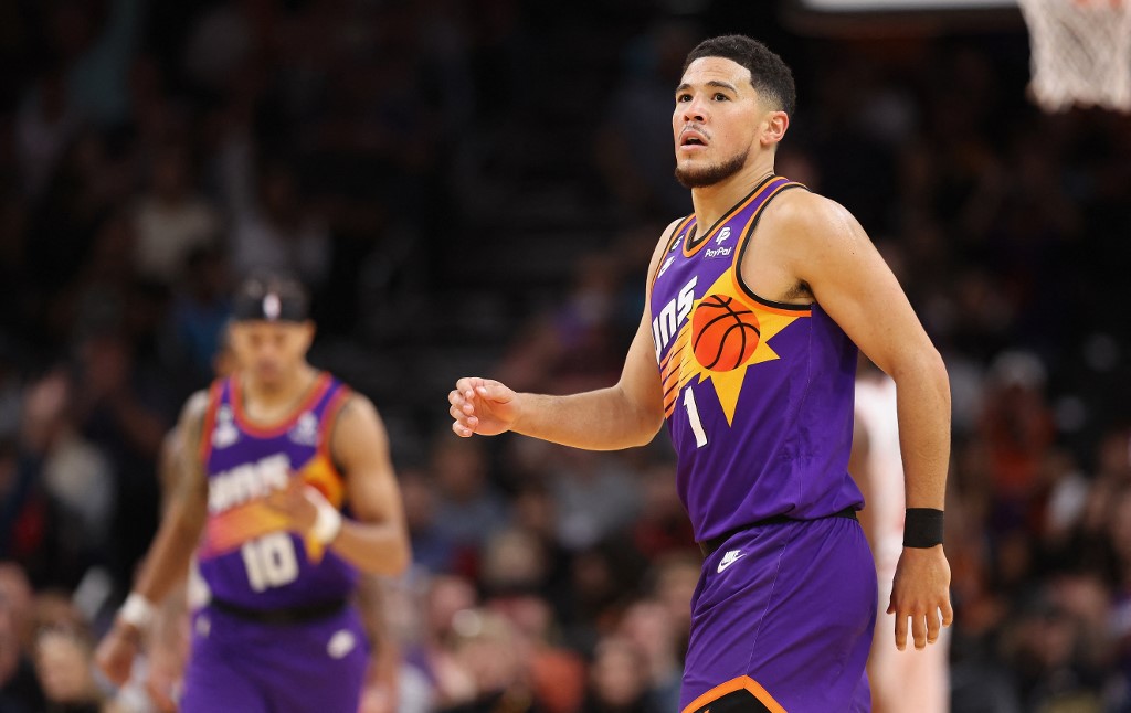 Devin Booker #1 of the Phoenix Suns reacts after a three-point shot against the Chicago Bulls during the second half of the NBA game at Footprint Center on November 30, 2022 in Phoenix, Arizona. 