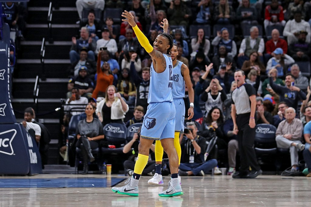 Ja Morant #12 of the Memphis Grizzlies reacts during the second half against the Oklahoma City Thunder at FedExForum on December 7, 2022 in Memphis, Tennessee.
