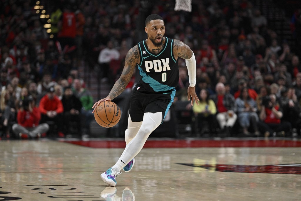 Damian Lillard #0 of the Portland Trail Blazers dribbles during the first quarter against the Minnesota Timberwolves at the Moda Center on December 10, 2022 in Portland,