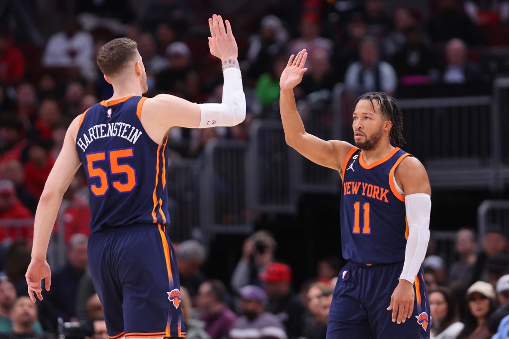  Isaiah Hartenstein #55 and Jalen Brunson #11 of the New York Knicks celebrate a basket against the Chicago Bulls during the second half at United Center on December 14, 2022 in Chicago, Illinois.