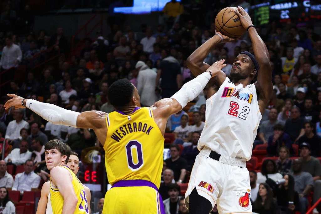 Jimmy Butler #22 of the Miami Heat defeated Russell Westbrook #0 of the Los Angeles Lakers in the first round of the match at the FTX Arena on December 28, 2022 in Miami, Florida. 