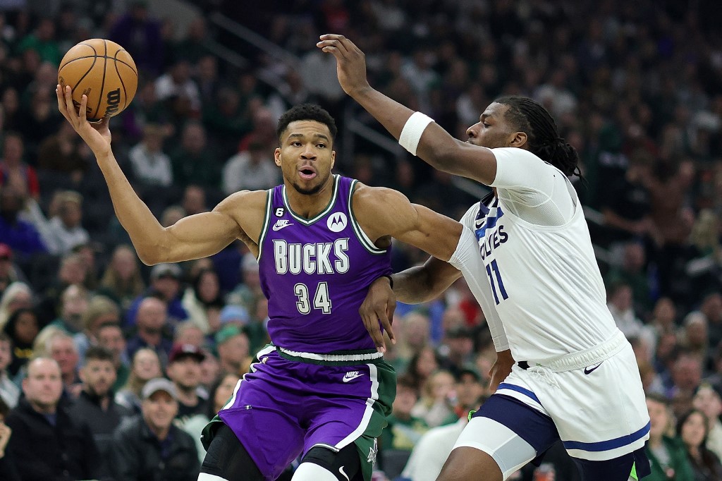 Giannis Antetokounmpo #34 of the Milwaukee Bucks drives to the basket against Naz Reid #11 of the Minnesota Timberwolves during the first half of a game at Fiserv Forum on December 30, 2022 in Milwaukee, Wisconsin. 