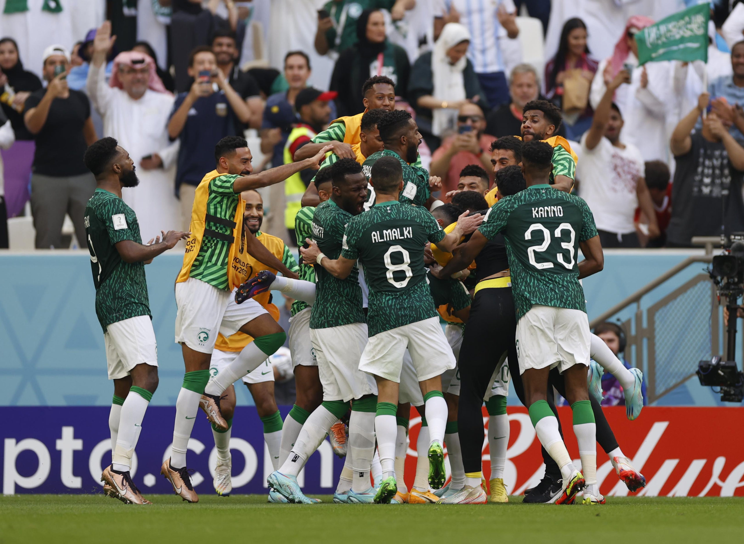 FILE PHOTO: Saudi Arabia midfielder Salem Al-Dawsari (10) is congratulated by teammates after scoring a goal against Argentina during a group stage match during the 2022 World Cup at Lusail Stadium. 