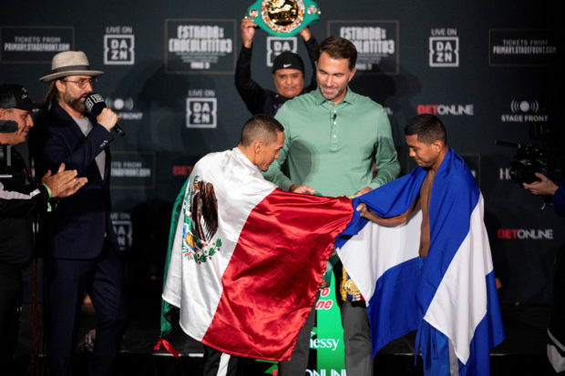 Nicaragua's boxer Roman "Chocolatito" Gonzalez fist bumps his opponent during a weigh-in ahead of his boxing bout against Juan Francisco Estrada in Glendale, Arizona, U.S., December 2, 2022. 