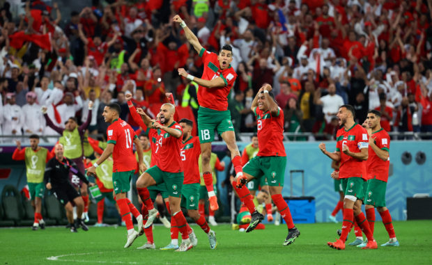 FIFA World Cup Qatar 2022 - Round of 16 - Morocco v Spain - Education City Stadium, Al Rayyan, Qatar - December 6, 2022 Morocco players celebrate after Achraf Hakimi scores the winning goal during the penalty shootout
