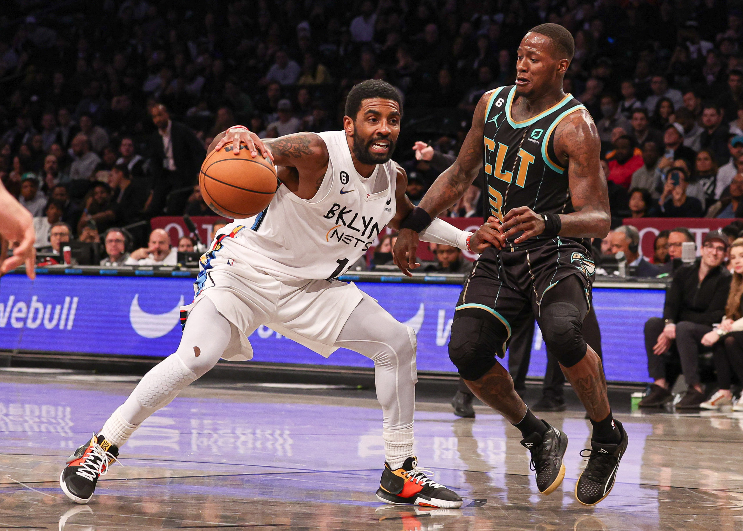  Brooklyn Nets guard Kyrie Irving (11) dribbles as Charlotte Hornets guard Terry Rozier (3) defends during the second half at Barclays Center