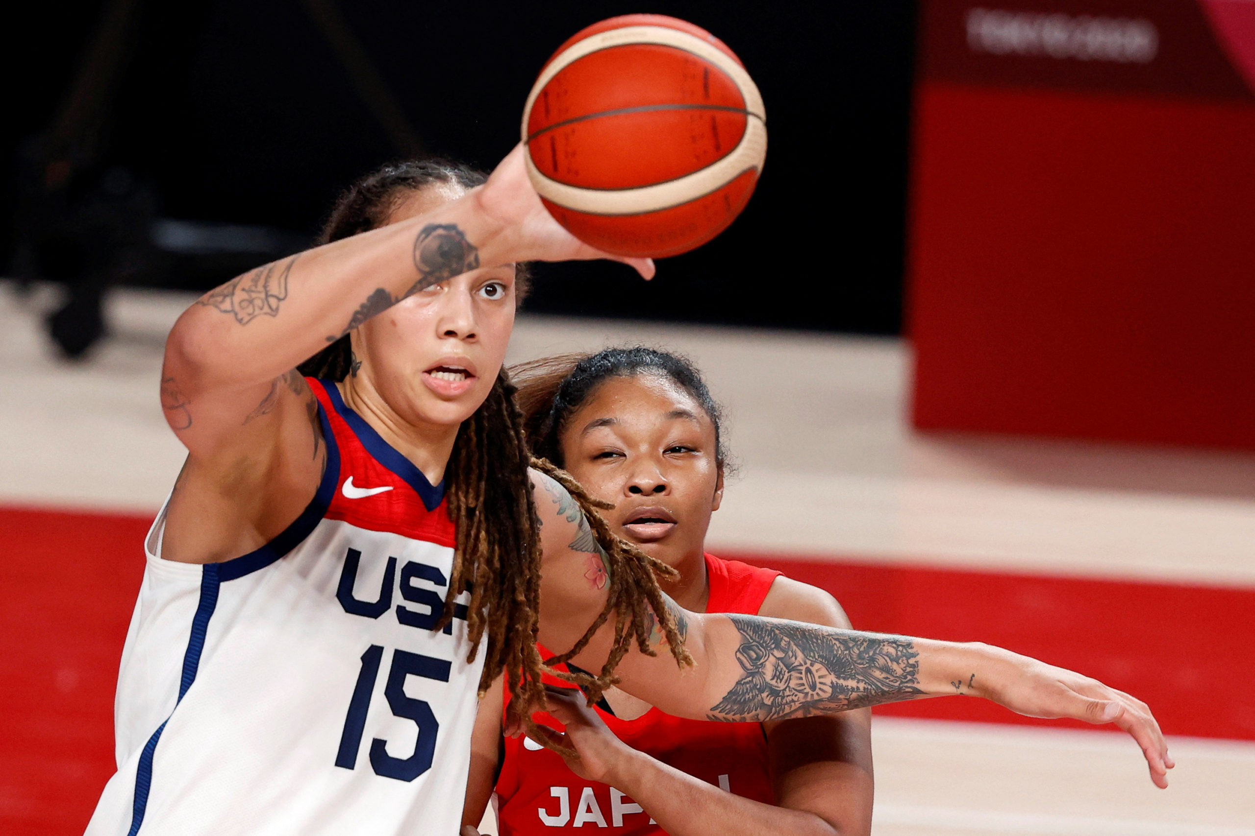 FILE PHOTO: Tokyo 2020 Olympics - Basketball - Women - Gold medal match - United States v Japan - Saitama Super Arena, Saitama, Japan - August 8, 2021. Brittney Griner of the United States in action with Monica Okoye of Japan 