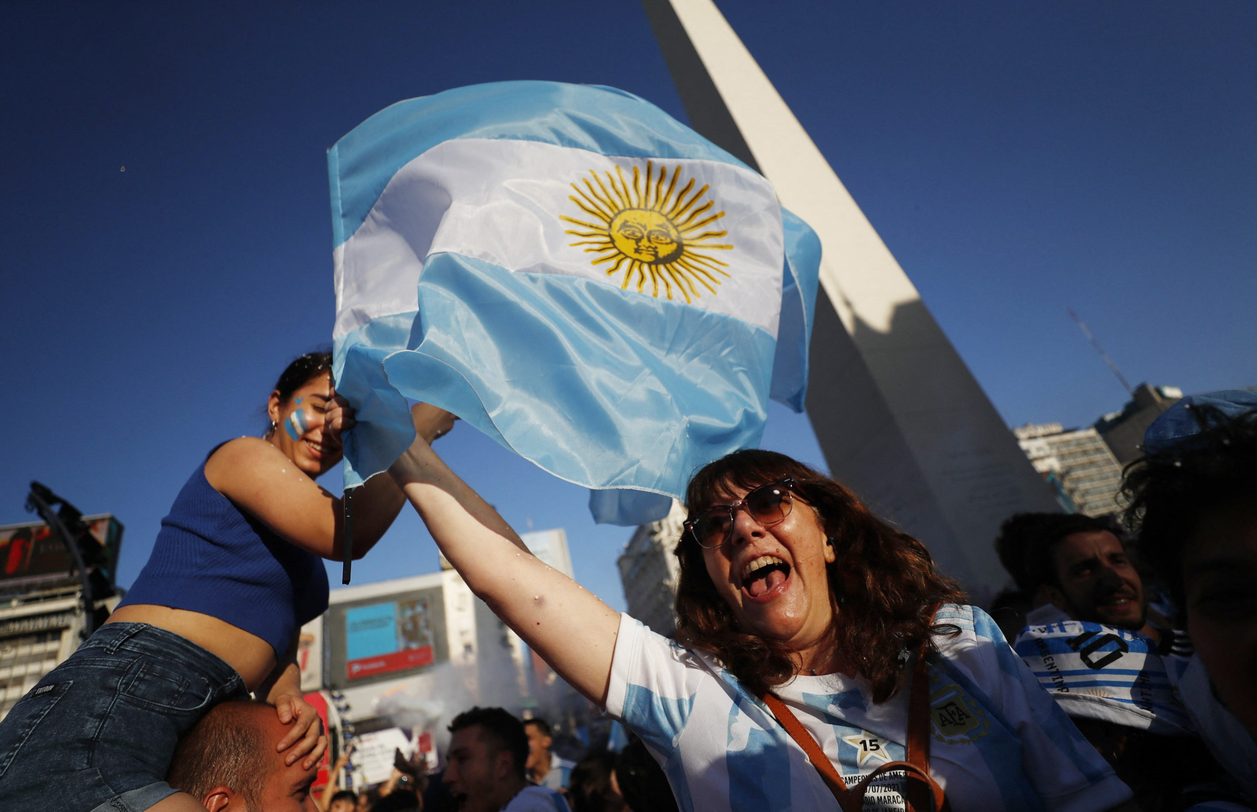 Soccer Football - FIFA World Cup Qatar 2022 - Fans in Buenos Aires watch Argentina v Croatia - Buenos Aires, Argentina - December 13, 2022 Argentina fans celebrate after the match as Argentina progress to the final 