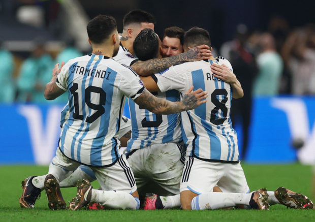 Argentina's Lionel Messi celebrates with his teammates after winning the World Cup.  STORY: Argentina won the final on penalties