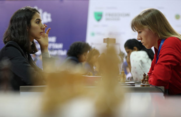 Chess - FIDE World Rapid and Blitz Championships - Rapid Women - Almaty, Kazakhstan - December 28, 2022. Sara Khadem of Iran (L) competes against Olga Girya of Russia. 
