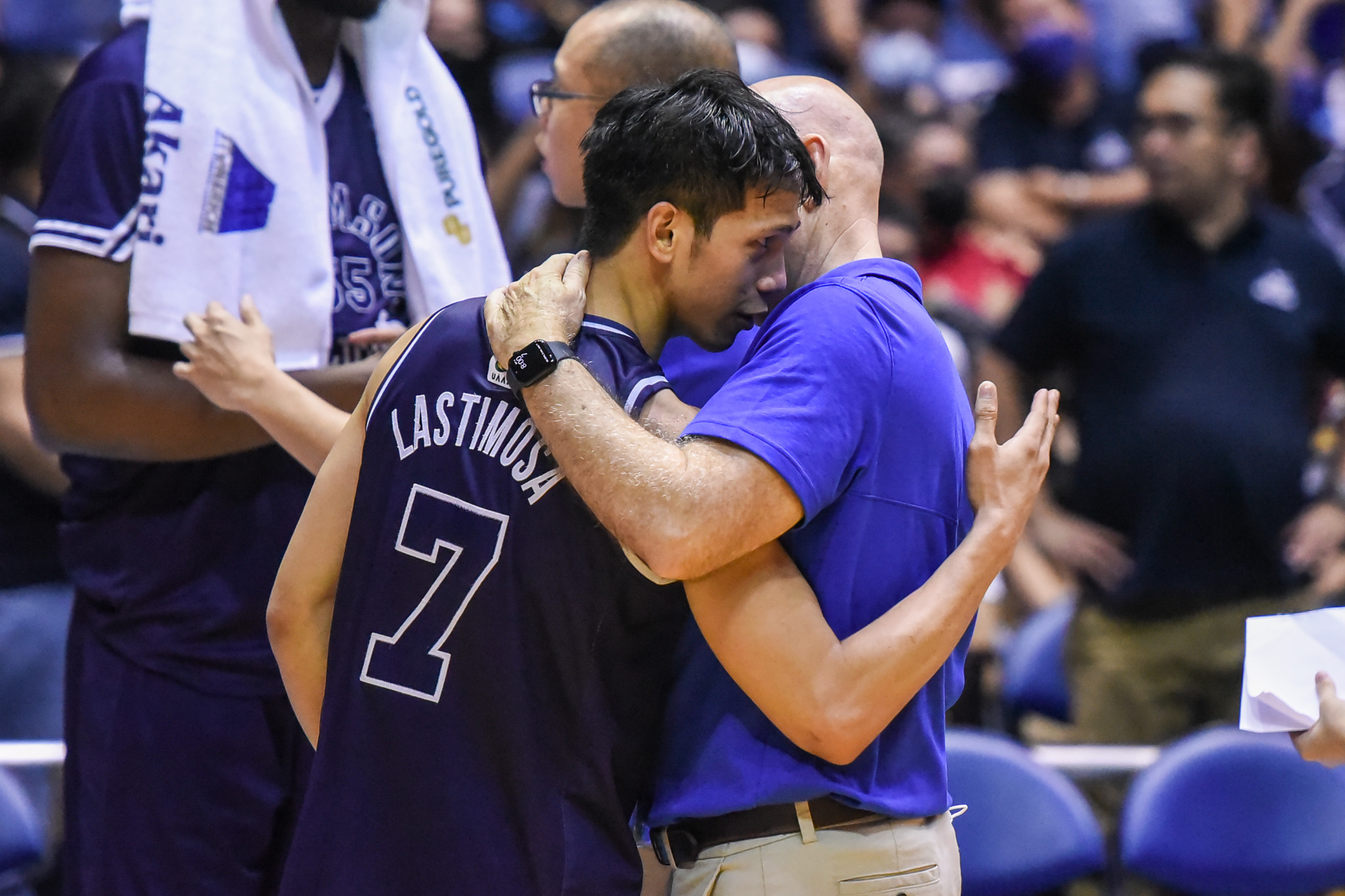 Adamson star Jerom Lastimosa and Ateneo coach Tab Baldwin hug it out after their Final Four match up. –UAAP PHOTO