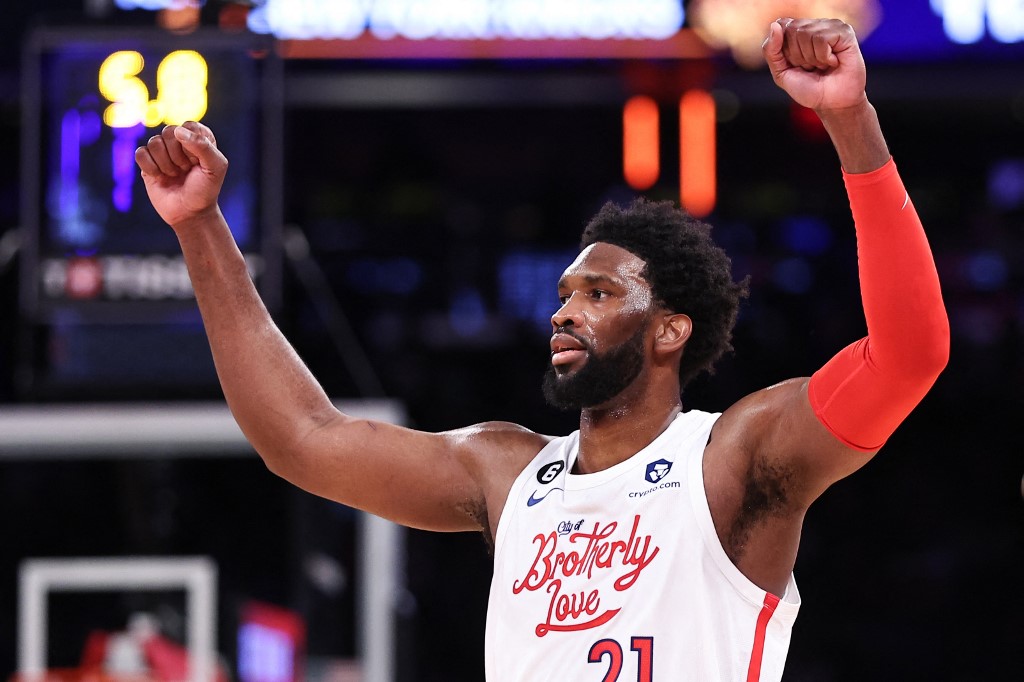 FILE–Joel Embiid #21 of the Philadelphia 76ers reacts during the fourth quarter of the game against the New York Knicks at Madison Square Garden on December 25, 2022 in New York City. 