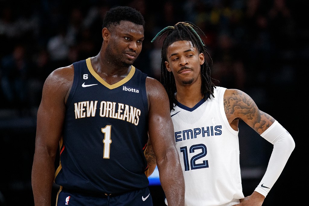 Zion Williamson #1 of the New Orleans Pelicans and Ja Morant #12 of the Memphis Grizzlies during the second half at FedExForum on December 31, 2022 in Memphis, Tennessee. 