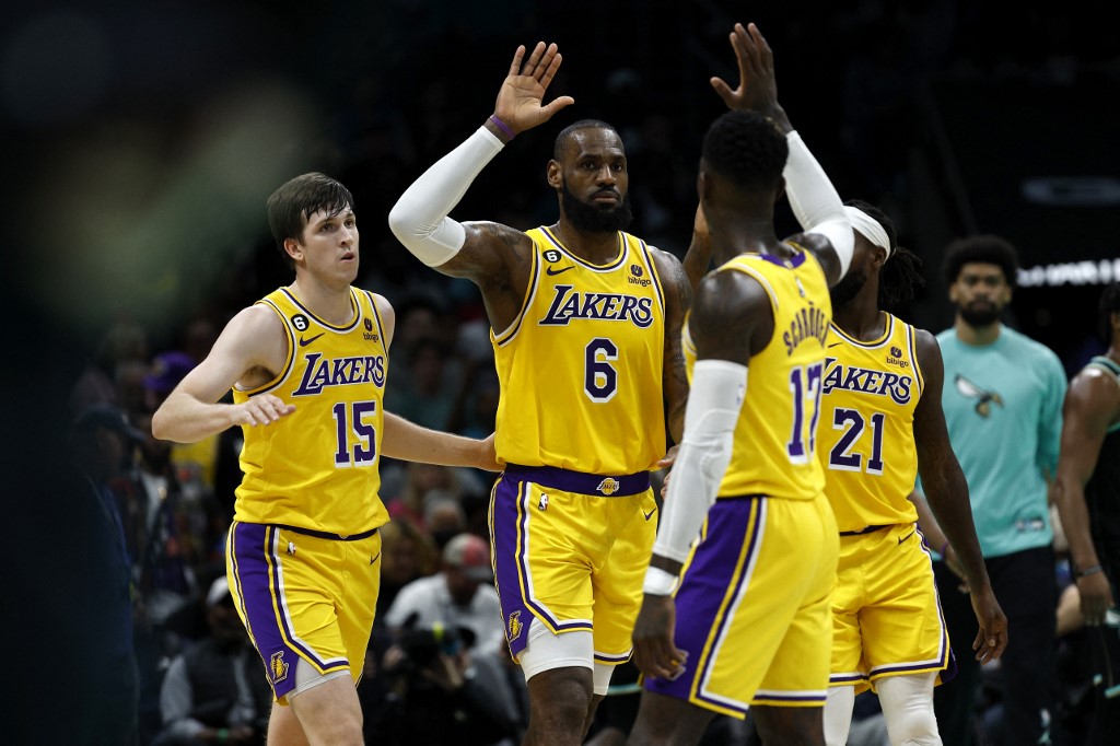 LeBron James #6 of the Los Angeles Lakers reacts with his teammates following a basket during the second quarter of the game against the Charlotte Hornets at Spectrum Center on January 02, 2023 in Charlotte, North Carolina