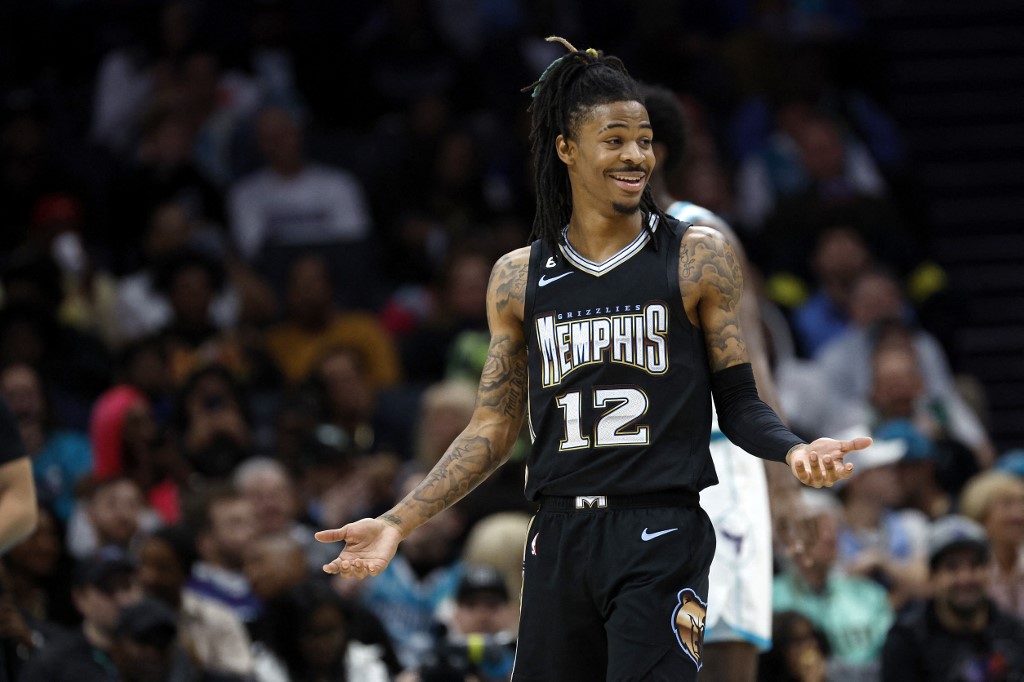 Ja Morant #12 of the Memphis Grizzlies reacts following a basket during the first quarter of the game against the Charlotte Hornets at Spectrum Center on January 04, 2023 in 