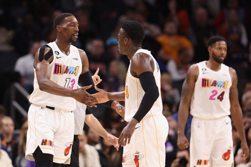  Bam Adebayo #13 of the Miami Heat high fives Victor Oladipo #4 after scoring against the Phoenix Suns during the second half of the NBA game at Footprint Center on January 06, 2023 in Phoenix, Arizona.