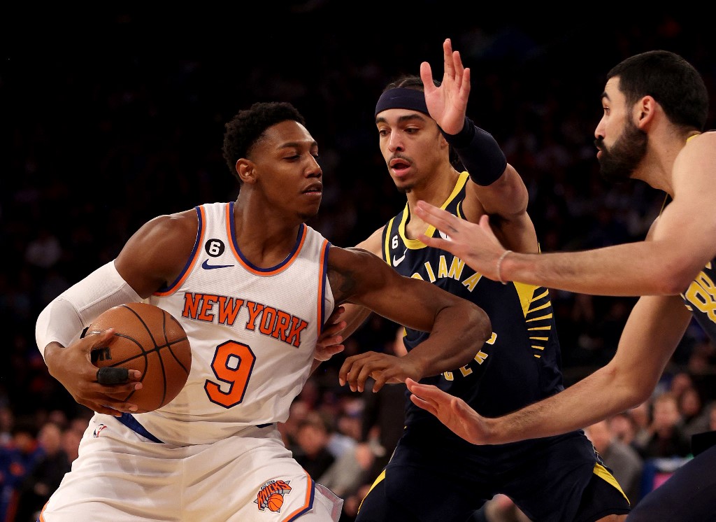 RJ Barrett #9 of the New York Knicks heads for the net as Andrew Nembhard #2 and Goga Bitadze #88 of the Indiana Pacers defend in the fourth quarter at Madison Square Garden on January 11, 2023 in New York City. 