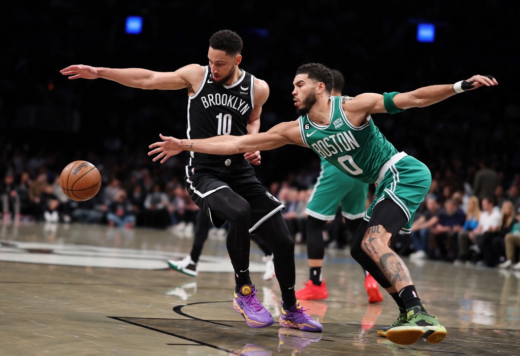 Ben Simmons #10 of the Brooklyn Nets and Jayson Tatum #0 of the Boston Celtics battle for the ball during their game at Barclays Center on January 12, 2023 in New York City.