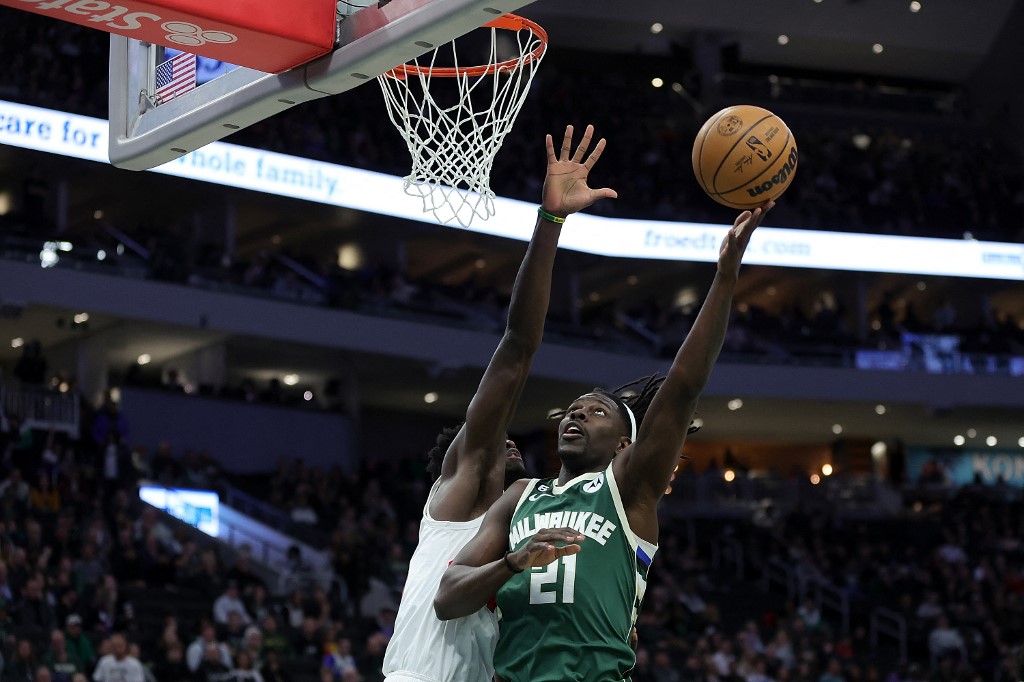 Jrue Holiday #21 of the Milwaukee Bucks drives to the basket against O.G. Anunoby #3 of the Toronto Raptors during the first half of a game at Fiserv Forum on January 17, 2023 in Milwaukee, Wisconsin.